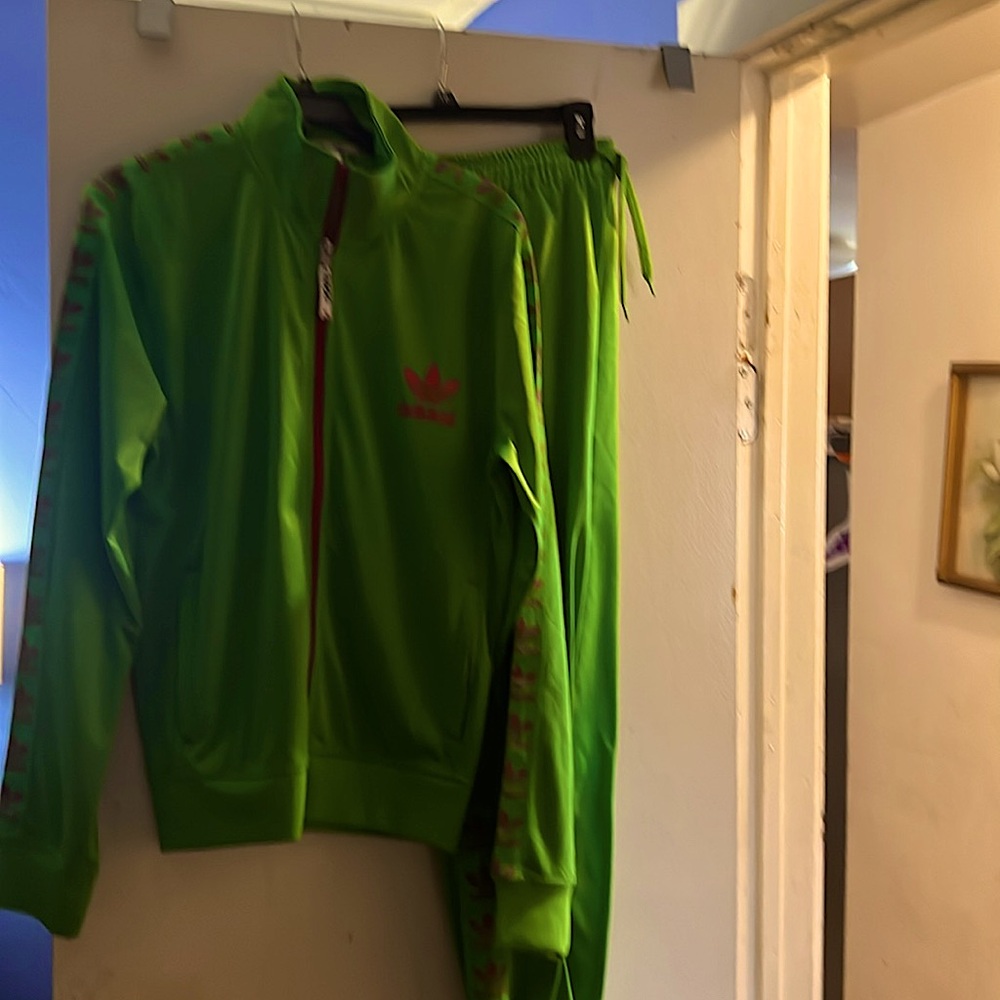 Adidas 2 piece track suit worn once.  Perfect like new condition.